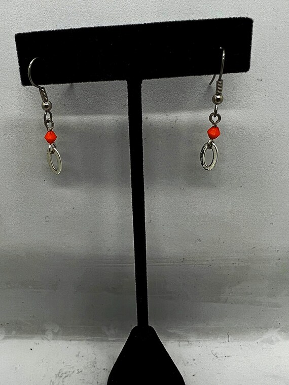 Orange and silver dangle earrings