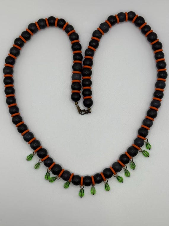 25" black, orange, and green necklace