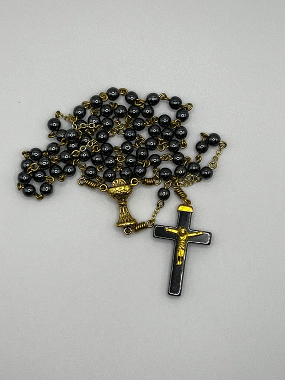 18" black glass bead rosary with chalice center and Hemalyke crucifix