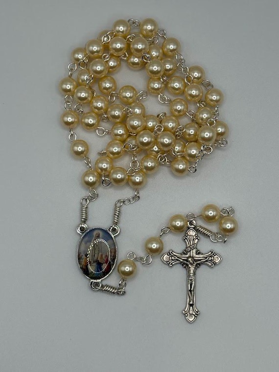 24.5" pearl bead rosary with Fatima center and Vatican crucifix