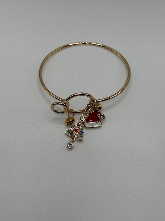 7" gold bangle bracelet with Santa hat, Christmas tree, and jingle bell charms