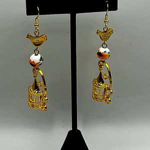 Sunflower and gold bird charm earrings