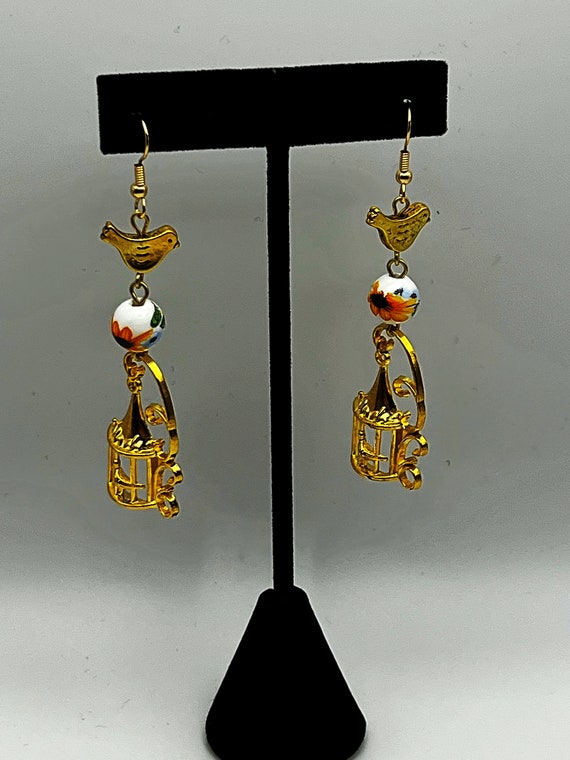 Sunflower and gold bird charm earrings