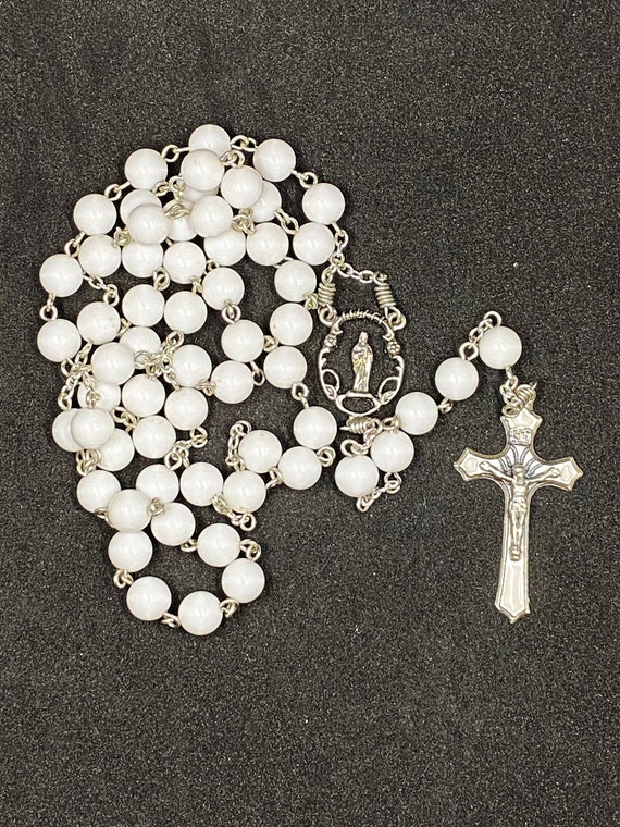 23" white bead rosary with Madonna center and enamel inlay crucifix