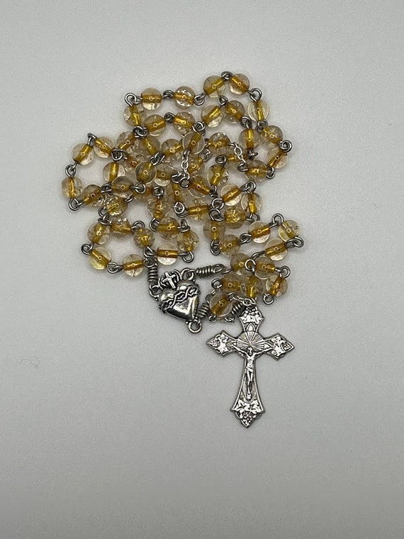 18.5" clear glass bead with honey core rosary with Sacred Heart center and fancy grapes crucifix