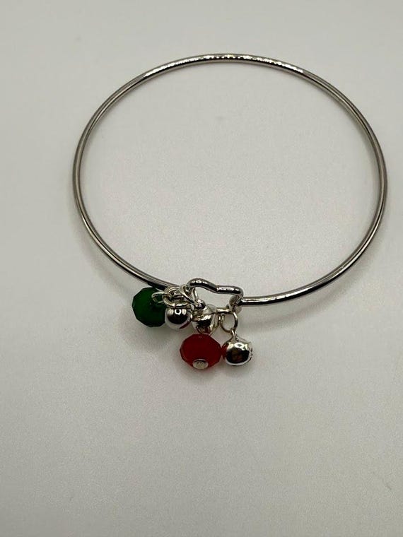 7.5" silver bangle bracelet with red and green glass beads and silver jingle bell charms