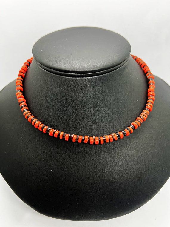 16" orange and black heshi and shell necklace