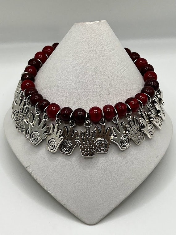 7" red glass bead and handprint charm bracelet