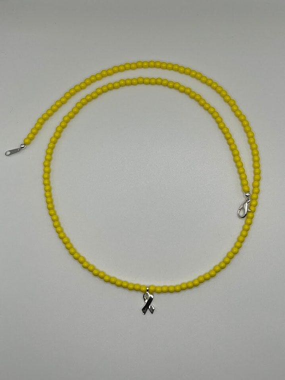 23" yellow glass bead necklace with silver awareness ribbon