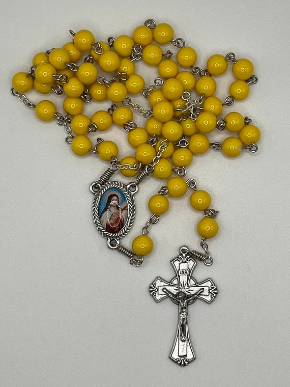 24.5" yellow glass bead rosary with St. Therese Lisieux center