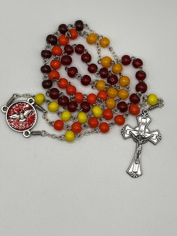 21" red/orange/yellow glass bead rosary with Holy Spirit center