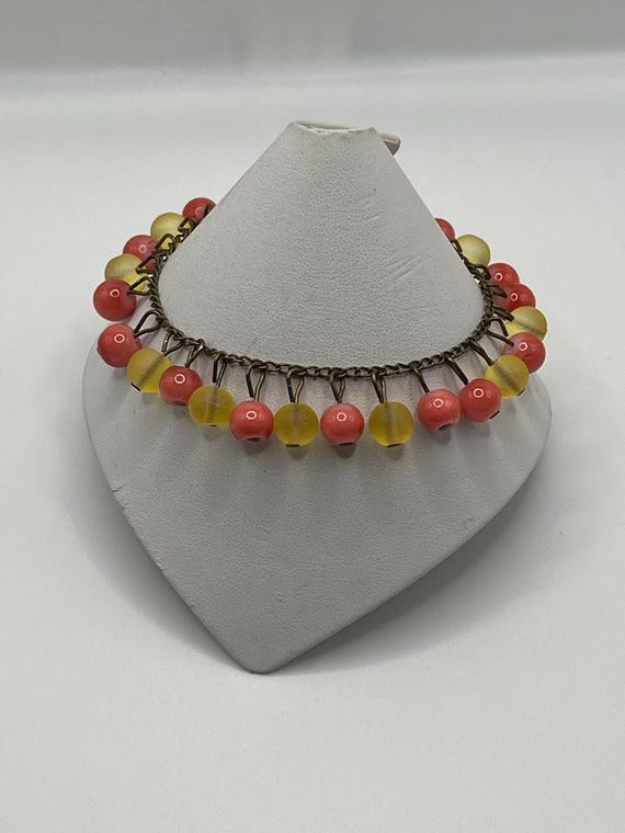 8" peach and yellow bead bracelet