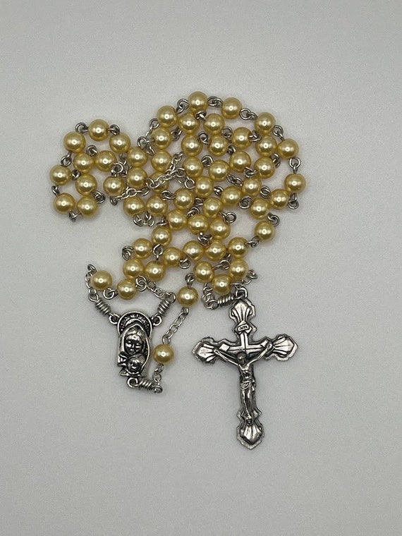 19" yellow pearl bead rosary with Madonna and Child center and shell crucifix