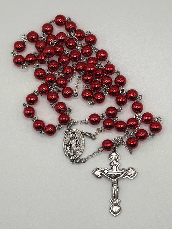 24"red shimmer bead rosary with IHM center and shell crucifix