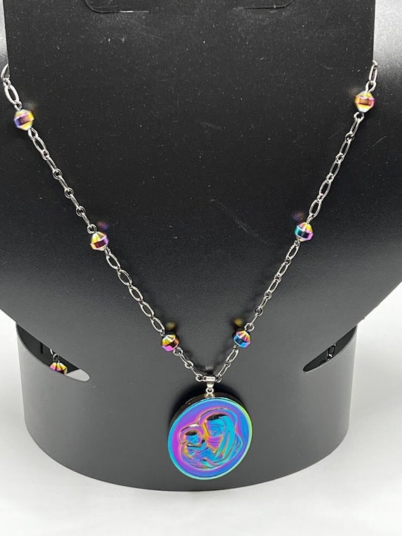 32" rainbow coated Madonna and Child pendant