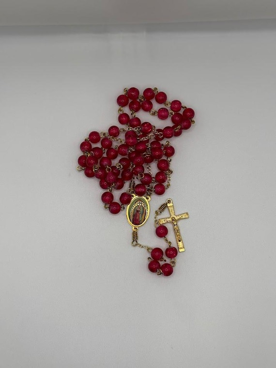 22.5" dark pink crackle glass bead rosary with Our Lady of Guadalupe center and crimped edge crucifix