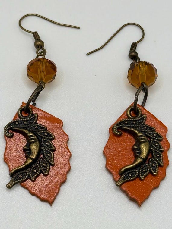 Brass moon and orange leaf earring