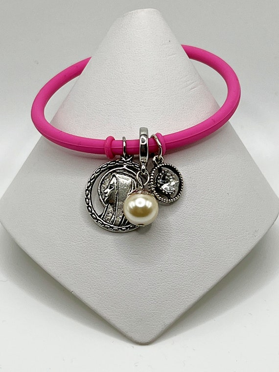 7.5" pink rubber cord charm bracelet