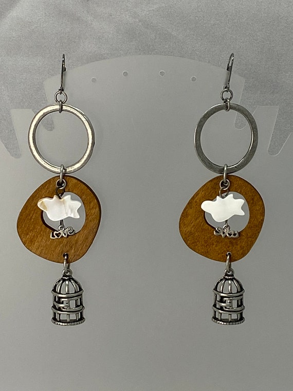 Bird and cage dangle earrings