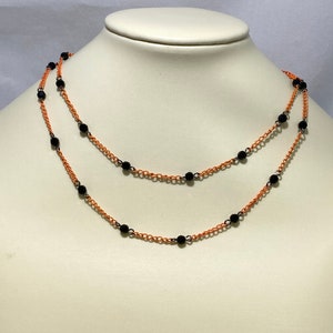 31" black Swarovski crystal on orange chain necklace