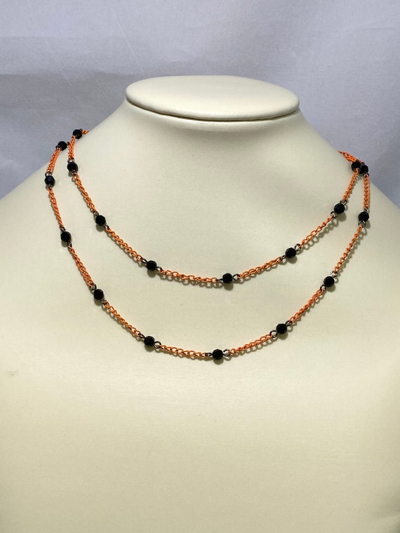 31" black Swarovski crystal on orange chain necklace