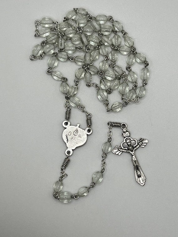 20.5" clear glass bead rosary with combination IHM, Madonna and Child, and SH with cross and Holy Spirit center and chalice crucifix