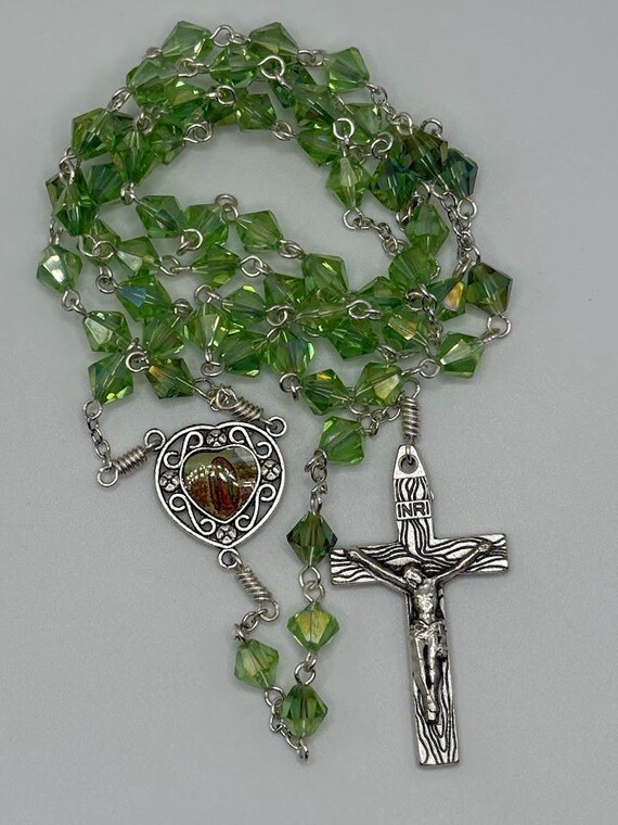 25.5" green crystal bead rosary with Our Lady of Guadalupe center and woodgrain crucifix