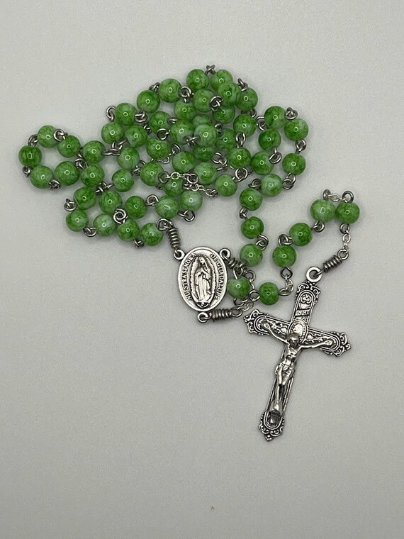 18" green glass bead rosary with Our Lady of Guadalupe center and ornate crucifix