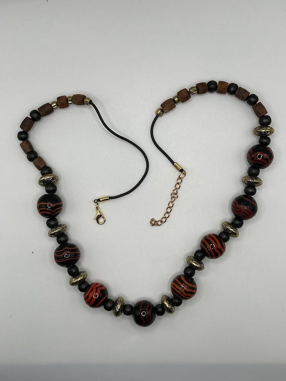 25" red, black, gold bead necklace