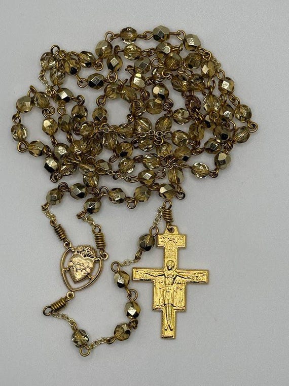 27.5" half coat gold and clear glass bead 7 decade crown rosary with Sacred Heart center and San Damiano crucifix.