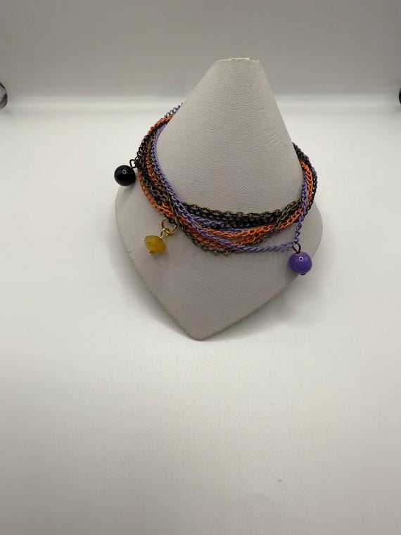 8.5" multi strand bead dangle bracelet