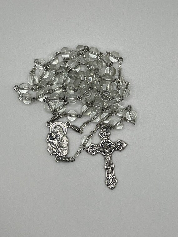 20" clear glass bead rosary with Madonna and Child center and ornate crucifix