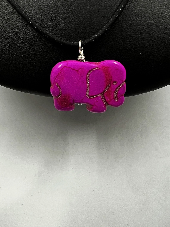 18" fuchsia or black carved howlite elephant on black rubber cord