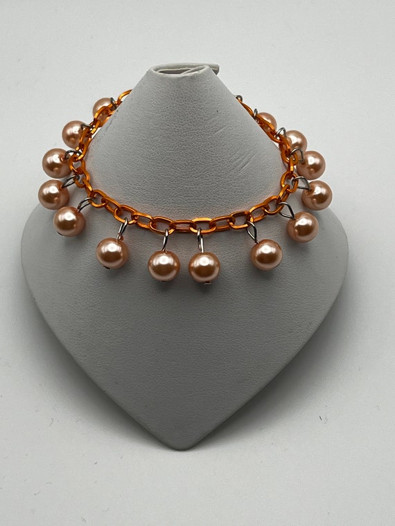 7" orange pearl bracelet