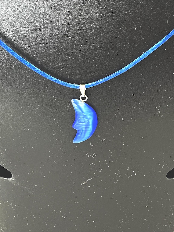18" blue cat eye pendant on blue cord