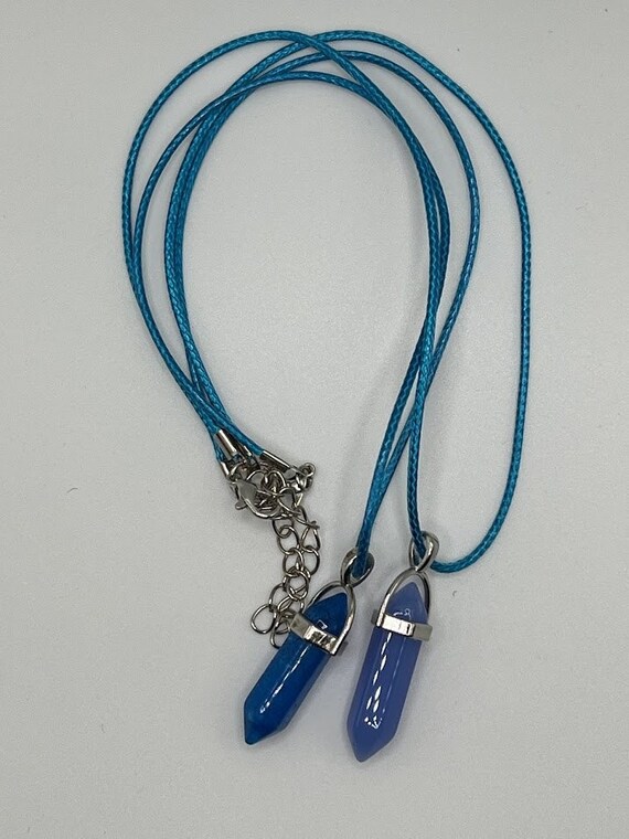 Blue glass pendant on 18" blue cord with silver lobster clasp and 2" chain extender