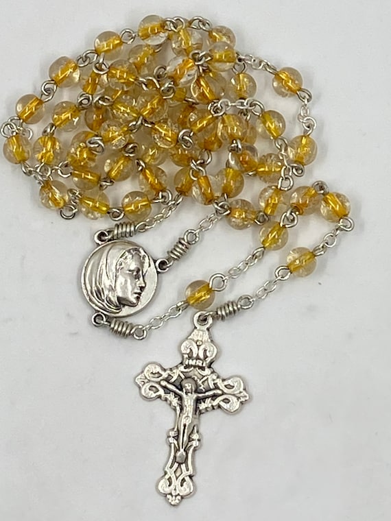 19"clear with honey glass bead rosary with Madonna center