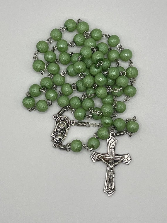 21" green shimmer bead rosary with Madonna and child center and fancy crucifix