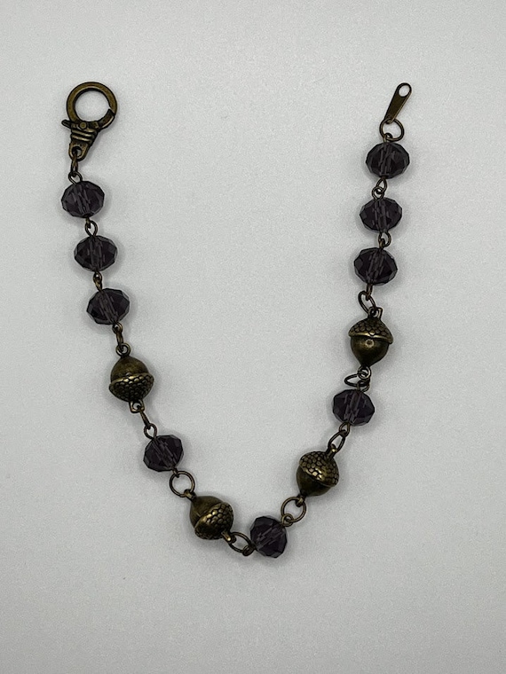 9.5" purple bead and brass acorn bracelet