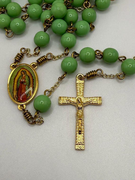 24.5" green glass bead rosary with Our Lady of Guadalupe center