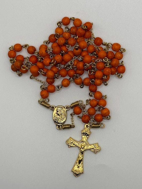 26.5" orange howlite 7 decade crown rosary with Madonna/Sacred Heart center