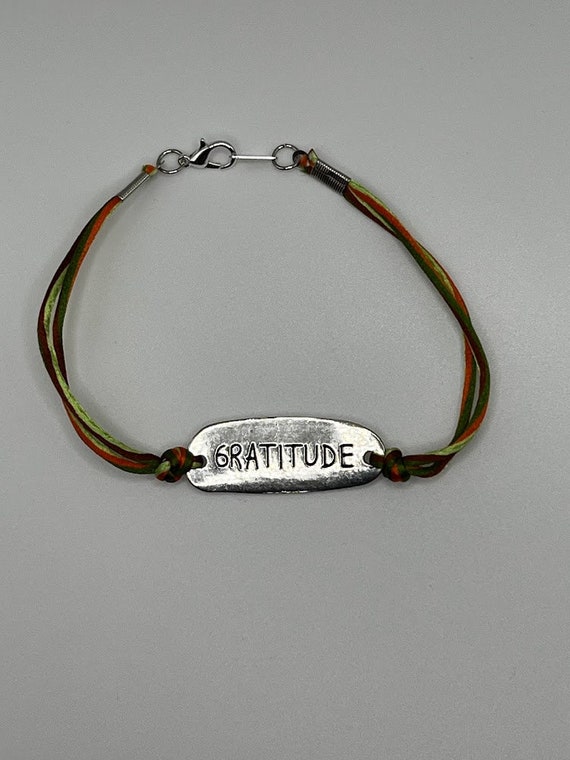 9.5" 'GRATITUDE' stamped focal on fall colors satin cord