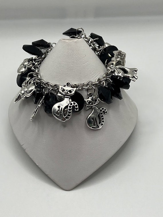 6" cats charm bracelet with black glass coins