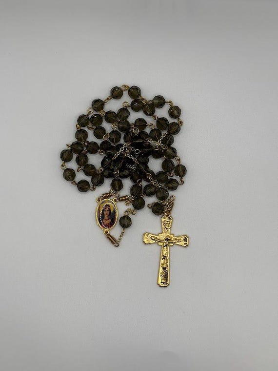 25" faceted gray crystal bead rosary with St Philomena center and stars and roses crucifix