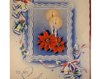 May include: Vintage Christmas card with the text "Christmas Greetings" and "To My Sweetheart." The card features a central image of red poinsettias and lit candles within a lace-edged frame. Bells, bows, and holly sprigs decorate the corners.