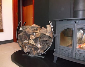 Wrought iron log holder, metal log basket, log storage, horseshoe log holder, fireside log holder, wood stove, hearth, fire tools. Horseshoe