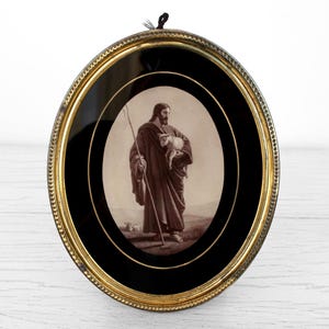 The Good Shepherd oval wall hanging 80s Vintage Jesus walking with sheep photo in golden frame