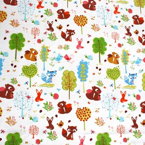 May include: A white fabric featuring a repeating pattern of brown squirrels, blue foxes, pink rabbits, and red birds. The design includes green and light blue trees, small snails, and colorful foliage scattered across the surface.