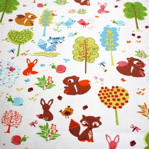 May include: A white fabric featuring a repeating pattern of woodland creatures including brown squirrels, orange foxes, and blue birds, interspersed with colorful stylized trees, green foliage, pink snails, and small red berries.