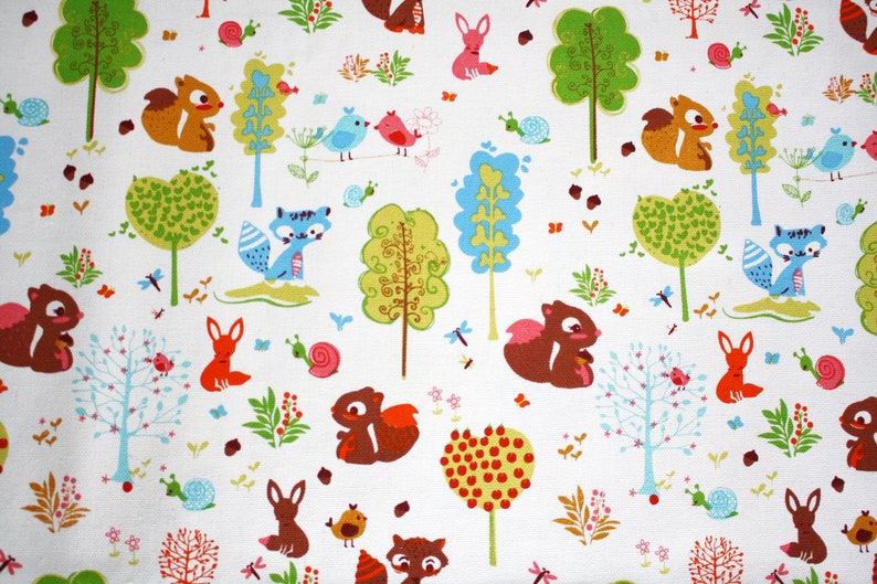 May include: A white fabric featuring a repeating pattern of woodland creatures including brown squirrels, orange foxes, blue birds, and snails. The design includes colorful stylized trees in shades of green, blue, and red, along with small flowers and acorns.
